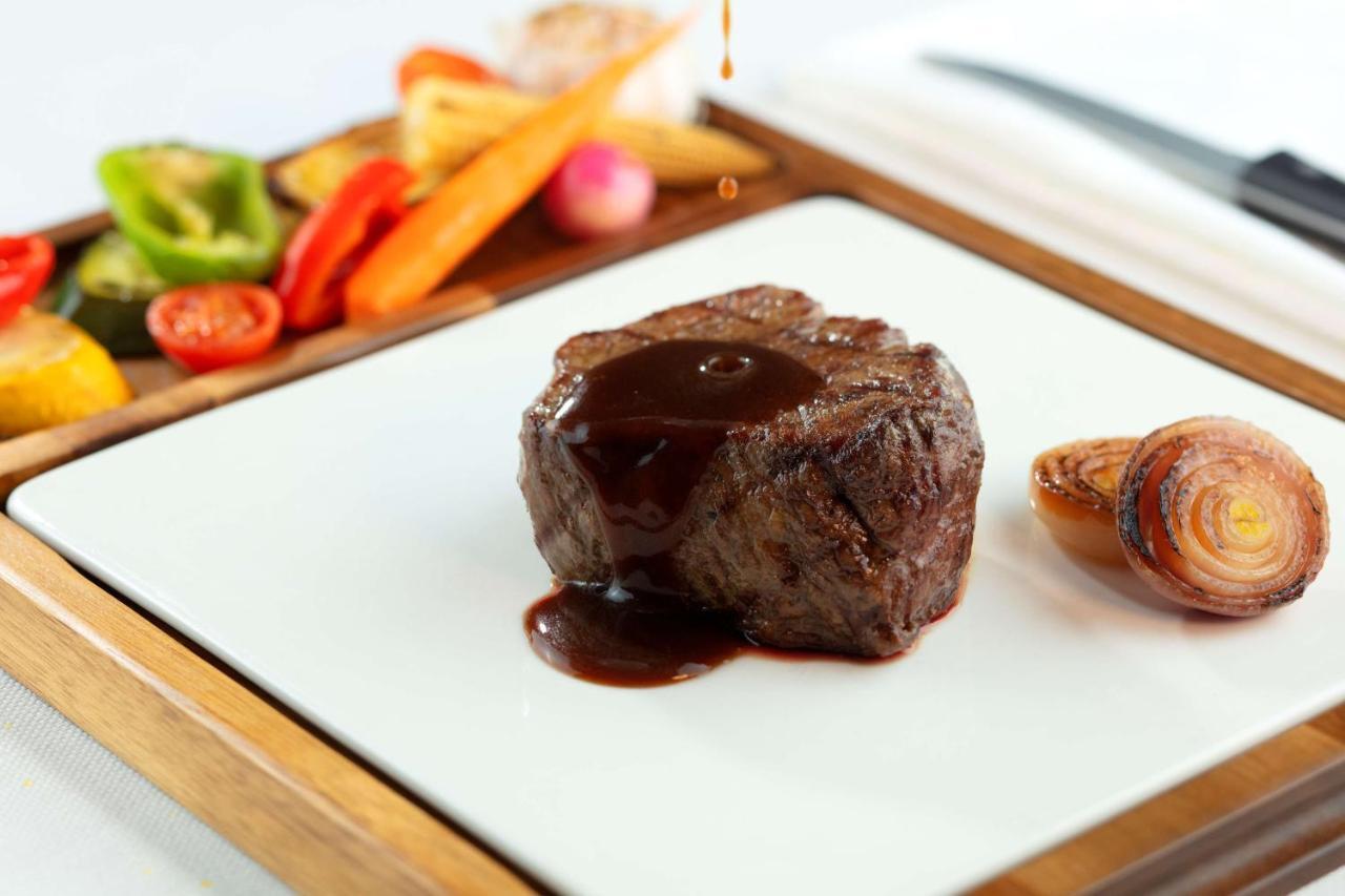 Symphony Style Hotel Kuwait Salmiya Екстериор снимка A steak with sauce